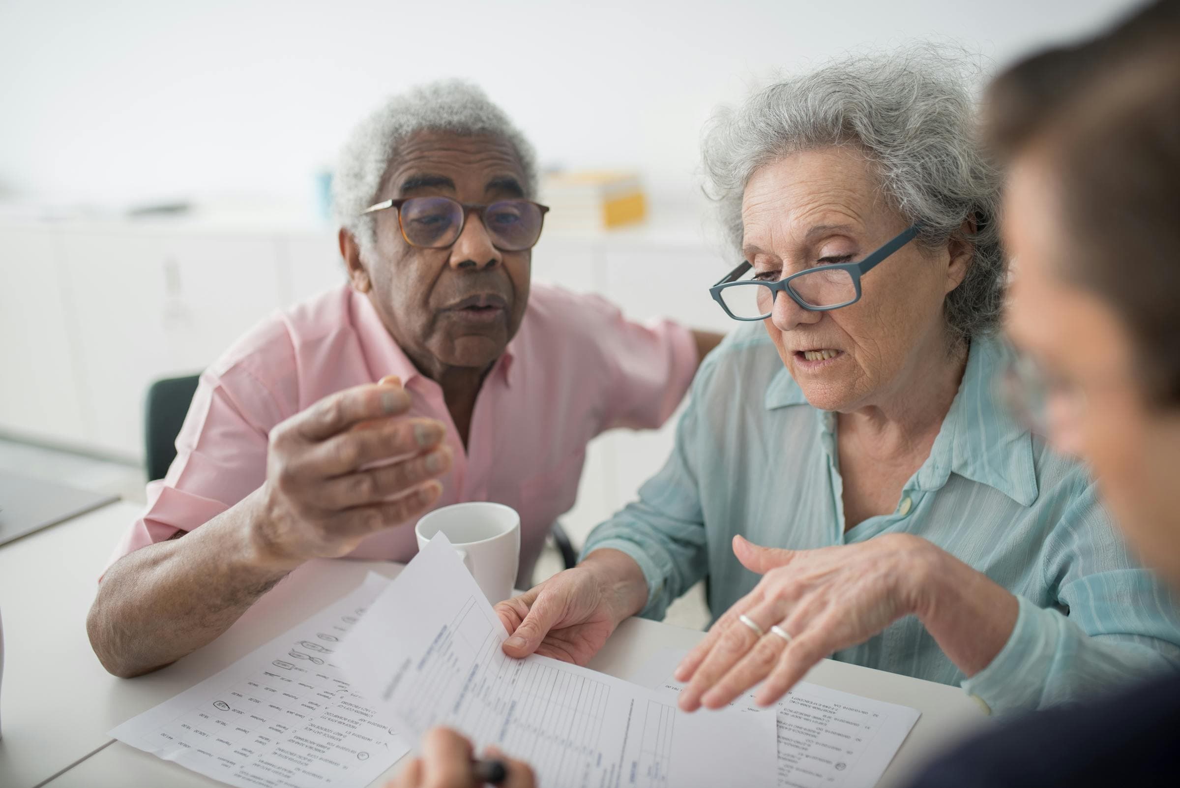 NJ Medicare advisor consulting with a senior client at home